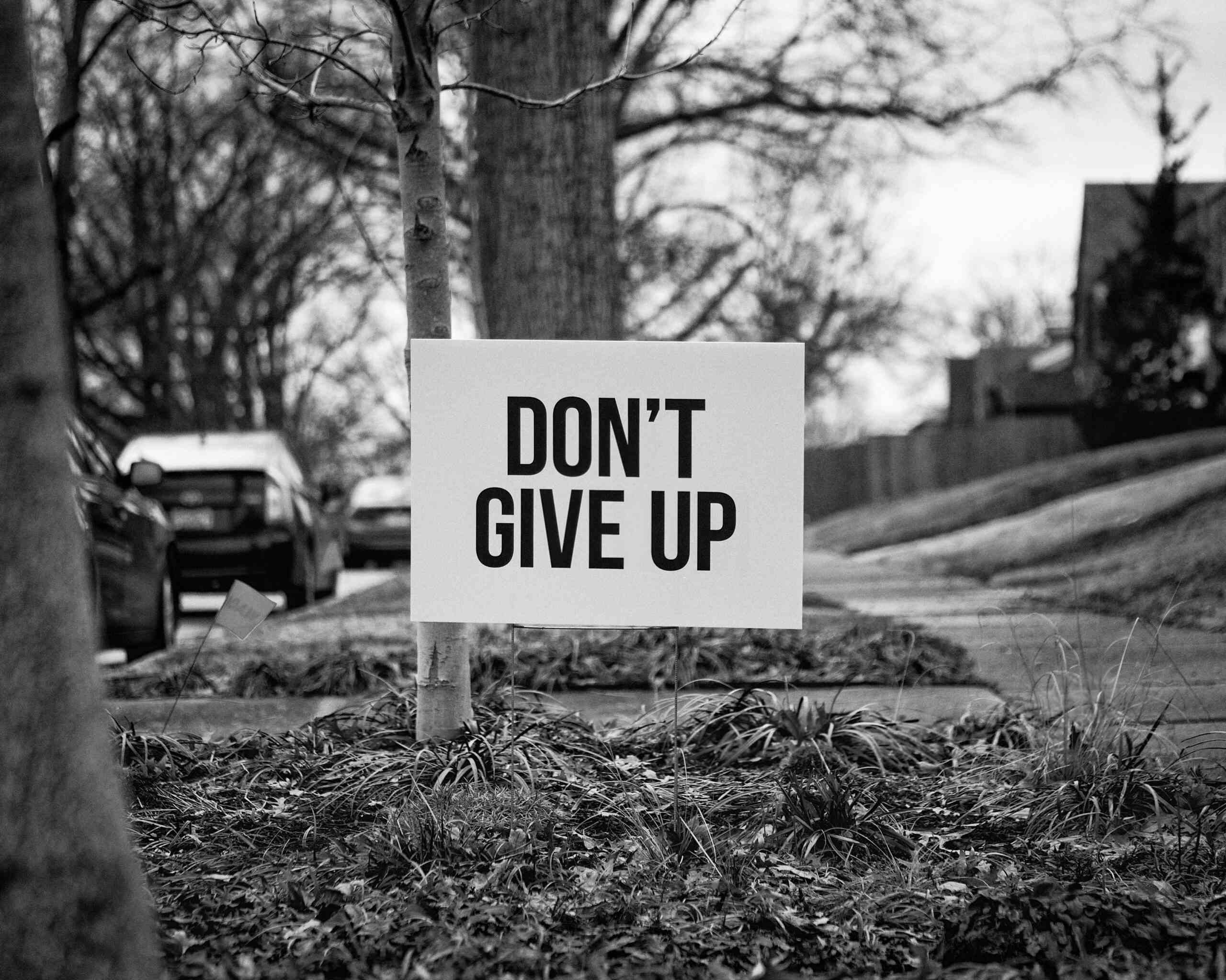 Do not give up written on a board